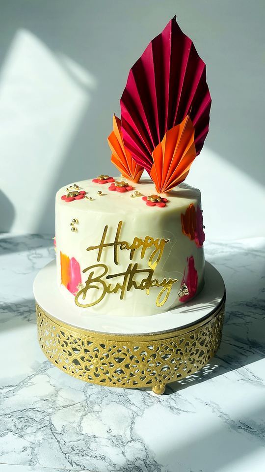 Birthday cake with paper fans in Playa del Carmen
