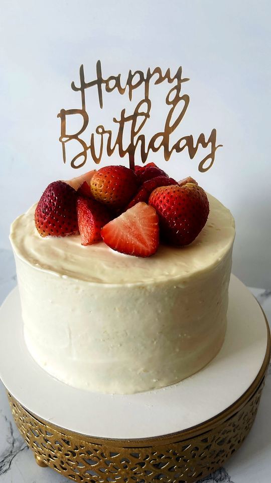 Birthday cake with fresh strawberries in Playa del Carmen