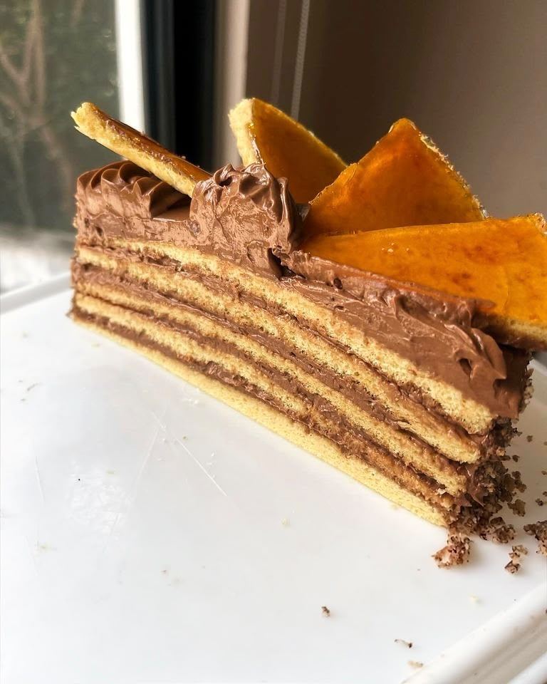 Layered Dobos torte with chocolate cream in Playa del Carmen
